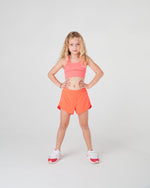 Girls recycled fabric sports shorts neon orange