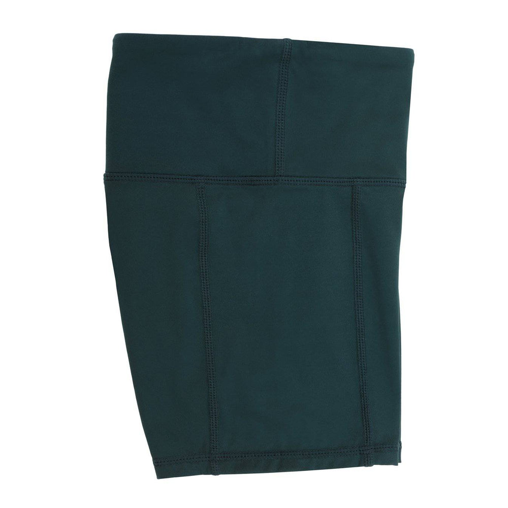 Forest green bike shorts worn under a school uniform, ideal for layering under dresses, skirts, and netball uniforms for extra coverage and comfort.